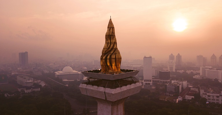 Sunset view of Jakarta’s National Monument’s gold-layered torch.