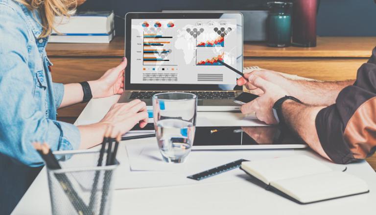 Entrepreneurs analyzing global financial data