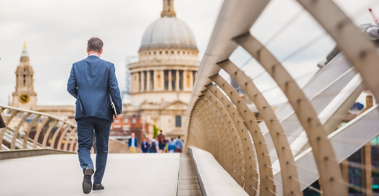 Canadian businessman walks to a meeting in a European capital.