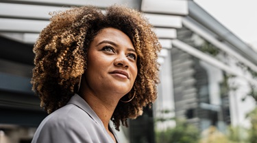 Closeup of stunning Brazilian businesswoman standing outside